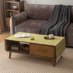 Japanese style green geometric table runner with storage pockets and white tassel edges
