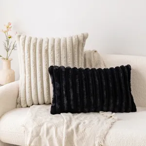 Modern minimalist soft vertical striped rabbit fur pillowcases displayed on a white sofa