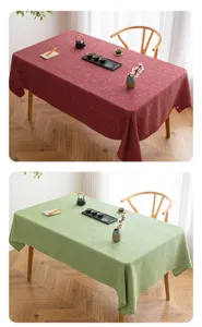 Comparison of red and green textured linen-like rectangular tablecloths in a tea room set