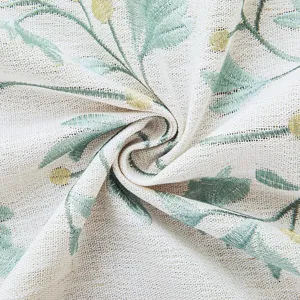 Close-up of modern minimalist embroidered curtain with delicate green floral patterns