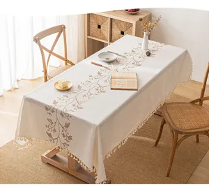 Cream embroidered tablecloth with tassels for elegant rectangular dining table decor