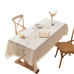 Vintage cream rectangular tablecloth featuring floral embroidery and elegant tassel edges