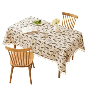Elegant cotton linen tablecloth featuring green fern leaf prints and decorative tassels