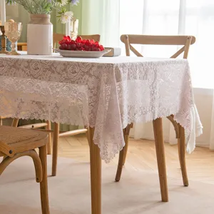 Elegant French lace tablecloth with hollowed rose pattern for rectangular dining tables.