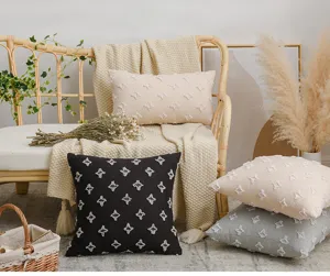 Detailed lifestyle view of Nordic star tufted cotton pillow covers on a cozy rattan sofa.