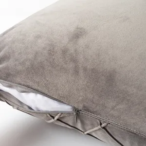 Close-up of grey velvet pillowcase with hidden zipper and diamond quilted pattern