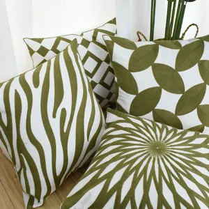 Set of four Nordic green embroidered pillowcases with geometric and nature patterns