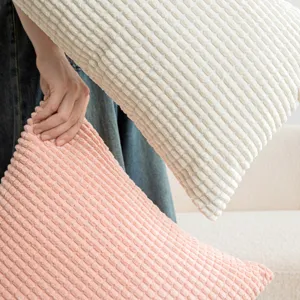Nordic style simple corn grain textured plush decorative pillow covers in pink and cream.