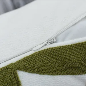 Detailed view of Nordic green geometric embroidered pillowcase with hidden zipper