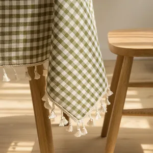 Nordic style green and white gingham tablecloth with elegant white tassel fringe detail
