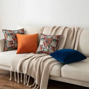 Retro tiger jacquard throw pillow covers and solid velvet cushions on a cozy sofa
