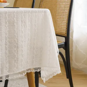 Elegant white lace tablecloth featuring delicate floral embroidery for pastoral home decor