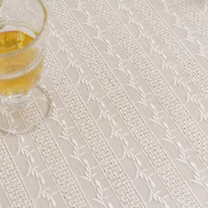 Elegant white lace tablecloth with delicate floral embroidery for pastoral home decor