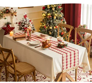 Festive red woven cotton linen table runner with tassels in Christmas setting
