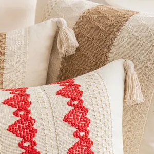 Boho chic jacquard tassel pillow cover with intricate red embroidery for cozy sofa decor