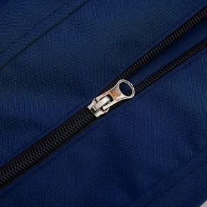 Close-up detail of a durable metal zipper on a navy blue waterproof outdoor cushion cover