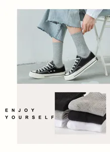 Classic ribbed mid-tube cotton socks in black, white, and grey for warm daily wear.