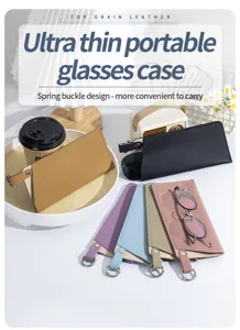 Vue détaillée d'étuis à lunettes ultra-fins en cuir véritable avec boucle à ressort.