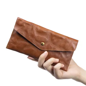 Portafoglio lungo vintage in pelle conciata al vegetale, pochette a busta color marrone