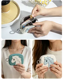 Close-up detail of genuine leather coin purse with double zippers and cute horse design