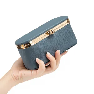 Elegante Mini-Schmuckschatulle aus Leder mit Kussverschluss für Lippenstifte und Münzen.
