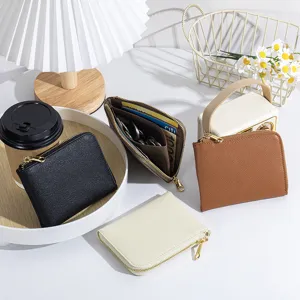 Compact genuine leather wallets with cross-hatch texture shown in multiple colors