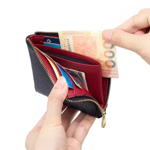 Compact black crossgrain leather zipper wallet with red interior and multi card slots
