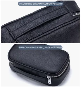Detailansicht der schwarzen Kulturtasche aus genarbtem Leder mit Riemen und Reißverschluss.
