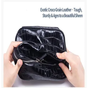 Detail shot of black exotic crocodile grain leather cosmetic bag showing internal space.