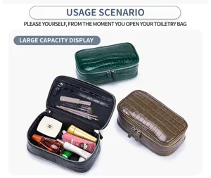 Crocodile embossed leather toiletry bag showing large capacity storage for makeup