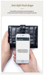 Demonstration of RFID-blocking technology on a black crocodile-texture leather wallet
