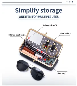 Detail view of the portable leather storage box with built-in mirror and compartments.