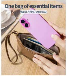 Detail of leather clutch showing capacity for phone, cards, and cash essentials