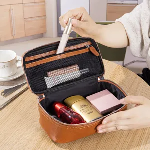 Large capacity brown faux leather cosmetic bag with compartments for travel storage