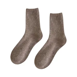 Pair of soft brown wool mid-calf socks for women with fuzzy texture for winter warmth