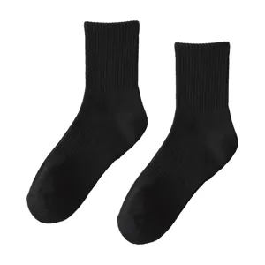 Classic black cotton mid-calf socks for men and women, warm and cozy winter essential.