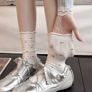 White floral pattern crew socks with cute ruffled edges and breathable mesh knit design