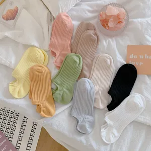 Close-up of colorful dopamine-toned ribbed no-show cotton socks in various soft pastel shades