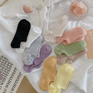 Detailed view of colorful low-cut ankle socks in various vibrant dopamine colors