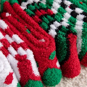 Close-up of soft and thick coral fleece Christmas socks in festive red and green colors