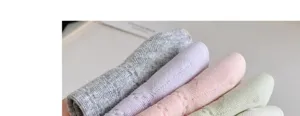 Detailed close-up view of soft knit women socks in various lovely pastel color options.