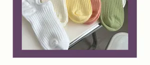 Close-up of pastel candy colored ribbed cotton boat socks showing soft knit texture