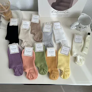 Assorted collection of candy colored ribbed cotton low-cut socks in macaron tones