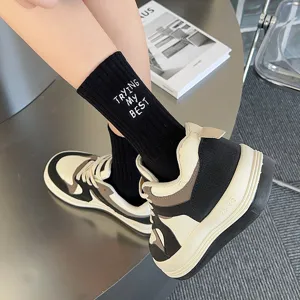 Black mid-calf socks for women featuring embroidered letter design, soft and comfortable cotton.