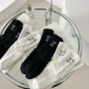 Black and white embroidered letter mid-tube socks, pure cotton sports casual socks main view.