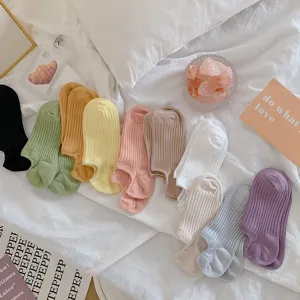 Macro view of colorful non-slip cotton invisible boat socks in various pastel tones