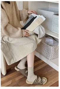 Detailed view of autumn winter solid color fine ribbed cotton mid tube women socks in stylish tones.