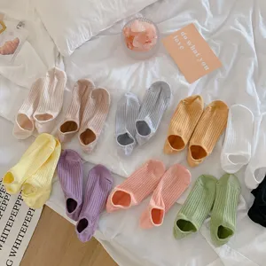 Detailed view of candy-colored ribbed invisible boat socks in various pastel shades