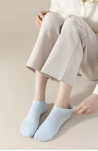 Detail view of breathable mesh invisible boat socks in light blue, showing fine knit texture.