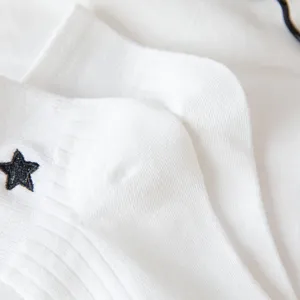 White short socks with black star embroidery, featuring cute college style for spring.